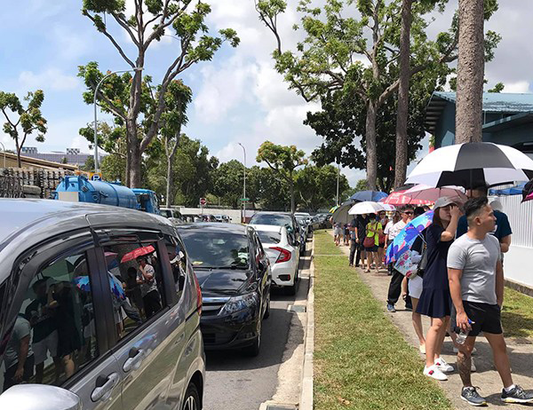 S’poreans go to Senoko, northern-most part of S’pore, queue in sun to buy 8 litres of disinfectant